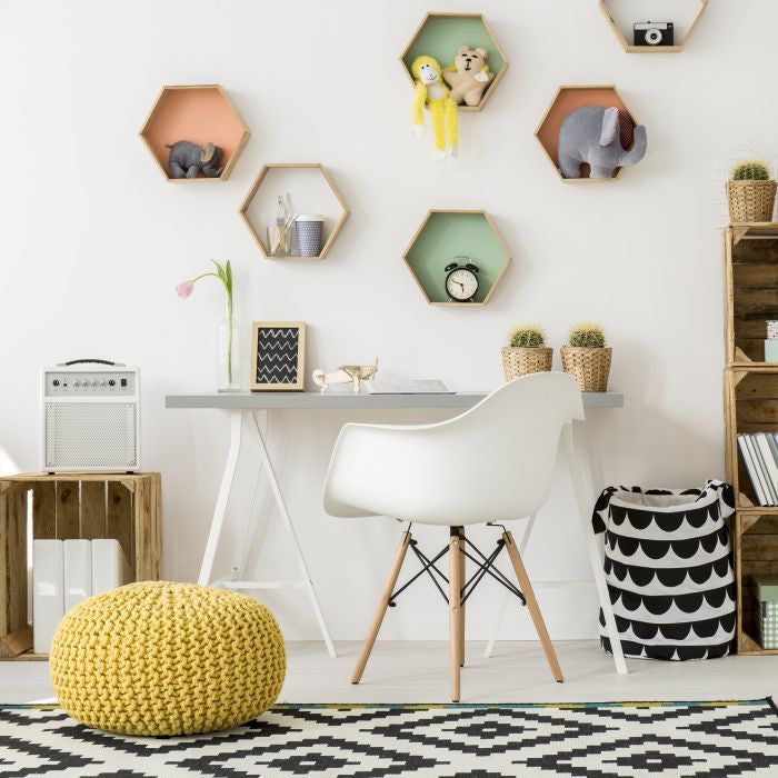 Modern light room with colourful hexagonal shelves.