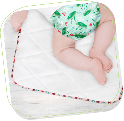 Step 3 nappy change image showing baby on a change mat Step 3 nappy change image showing baby on a change mat