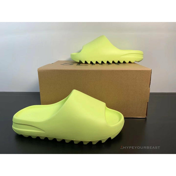 green glow yeezy slides on feet