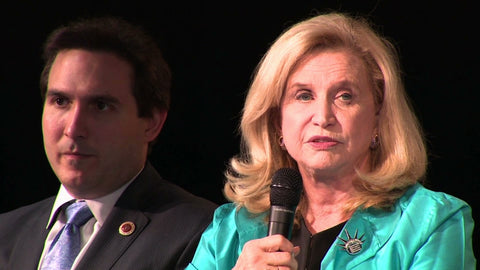 US Congresswoman Carolyn Maloney wearing the “National Women’s History Museum” pin design by Michele Benjamin