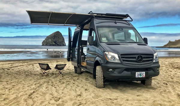 RoamBuilt Shadowrack van awning on a Mercedes Sprinter van at the beach