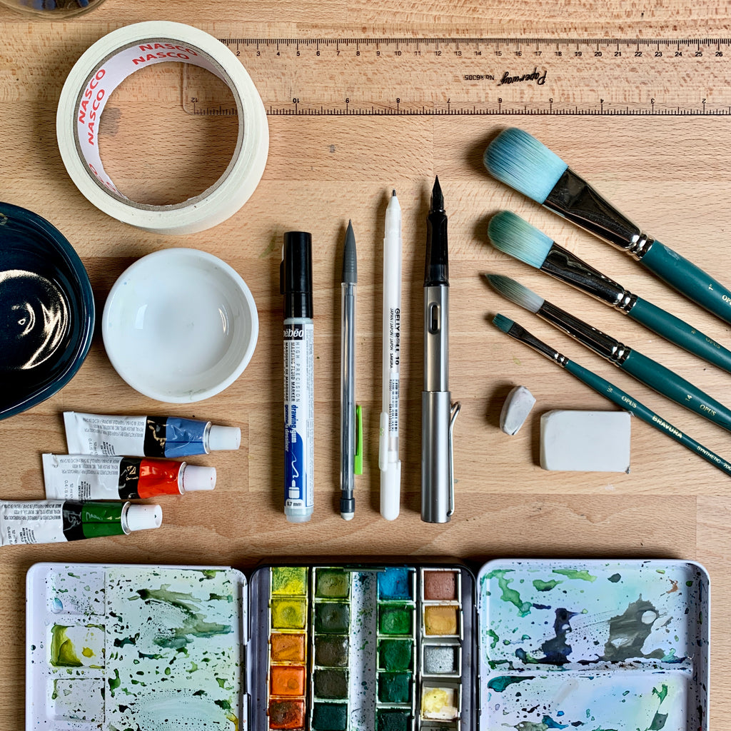Flatlay image of watercolour painting materials