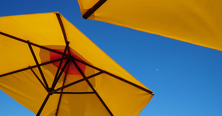 yellow umbrella with a blue sky