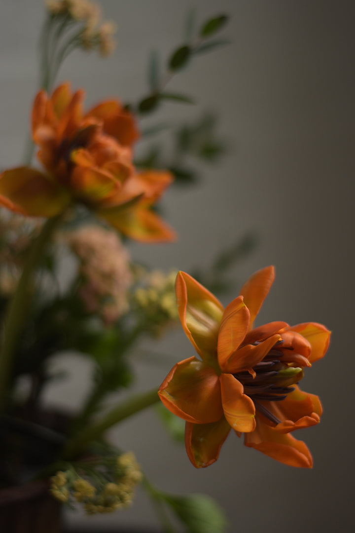 Flowers donated to frontline workers in peach, coral and orange tones