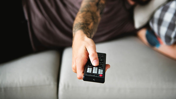 couch potato with a tv remote