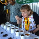 Tea Connoisseur and shop owner tasting white, green, and black teas in Kumaon India