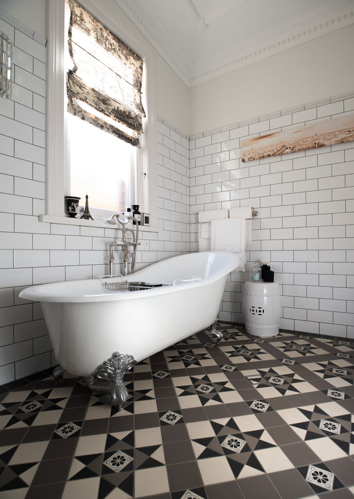 French Provincial bathroom with tessellated tile floor