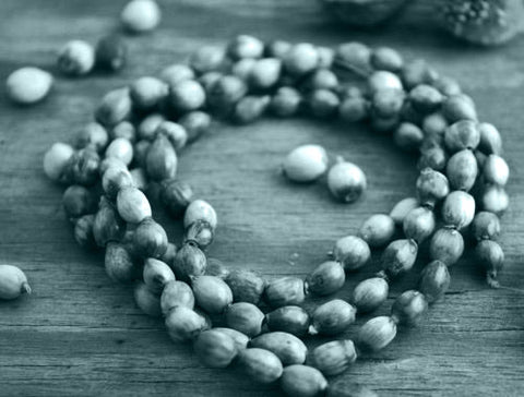 a close up picture of a wooden rosary