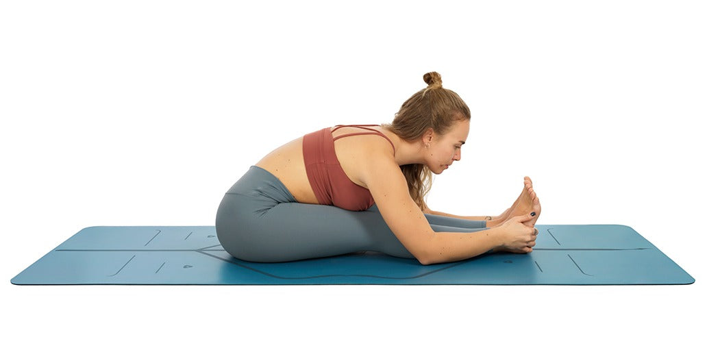 Seated Forward Fold (Paschimottanasana) is a classic seated yoga pose