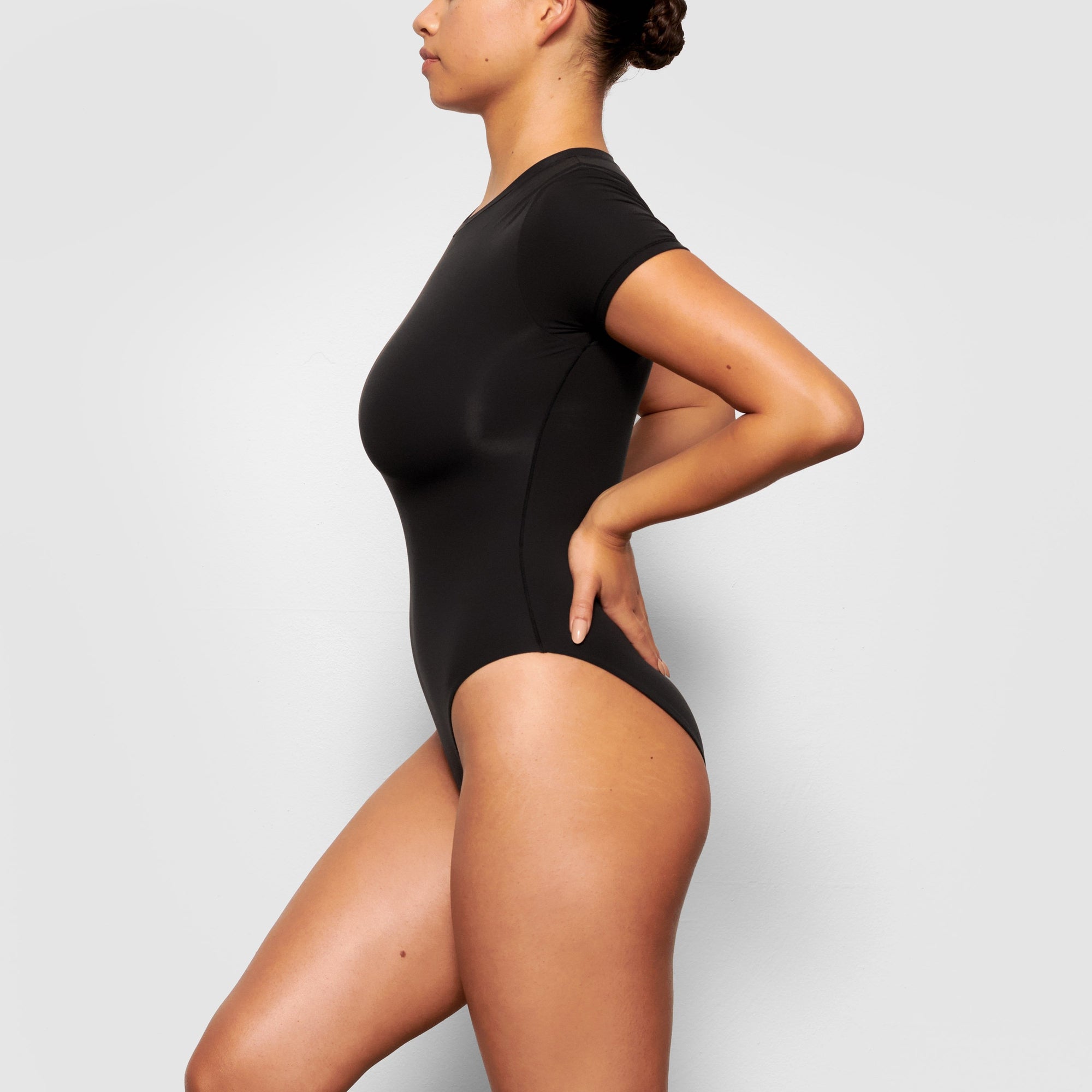 SKIMS - Meet: The Fits Everybody T-Shirt Bodysuit. It's our new everyday  style and you'll love the way it molds to your body and never loses shape.  Now, excuse us while we