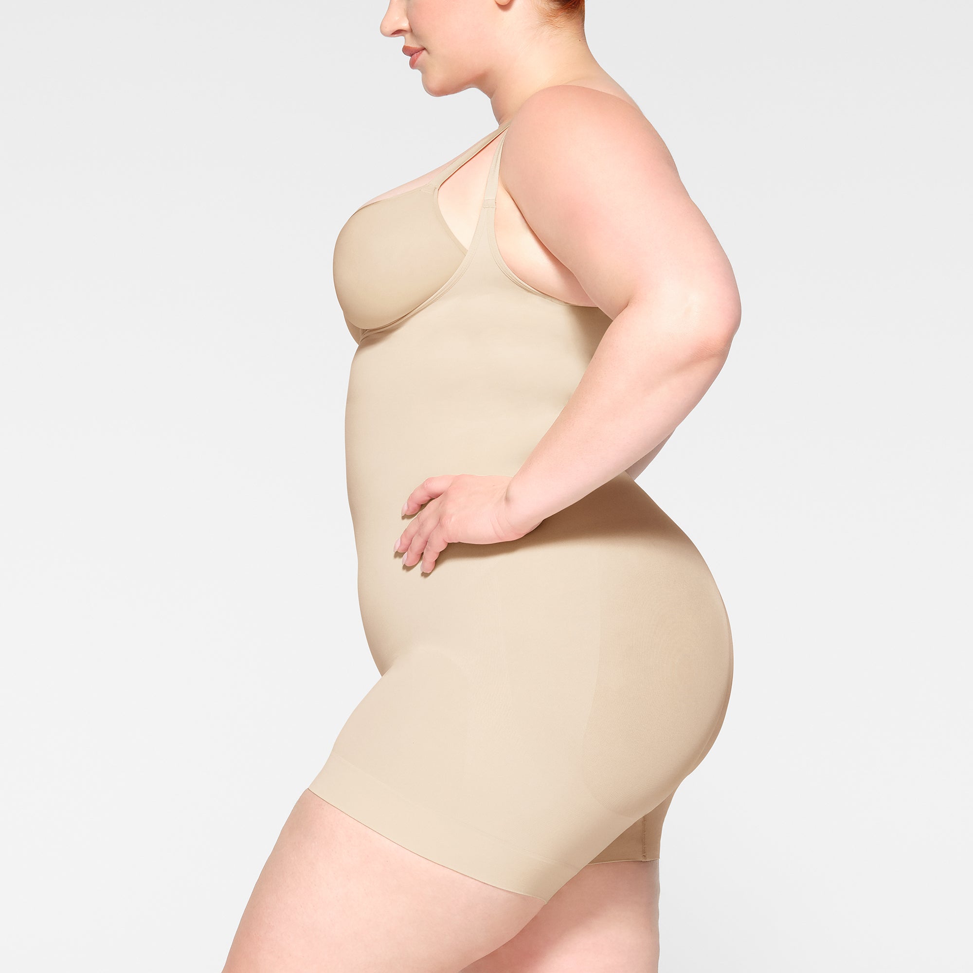 SEAMLESS SCULPT OPEN BUST SHORTIE BODYSUIT | SAND