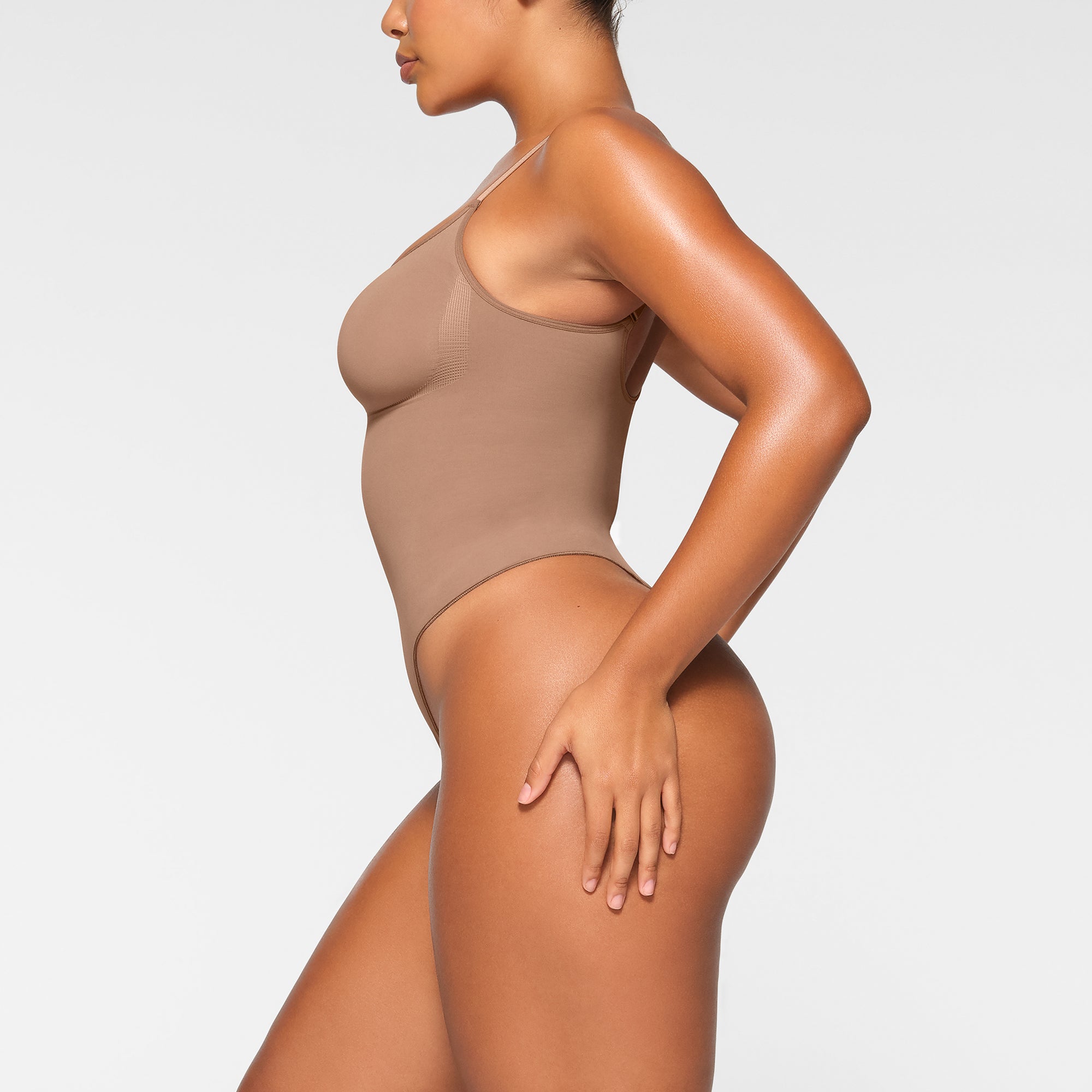 SKIMS on X: Breathable comfort with incredible support, @KimKardashian  wears the Sculpting Bodysuit Mid Thigh in Sienna. Shop now in sizes XXS -  5X:   / X