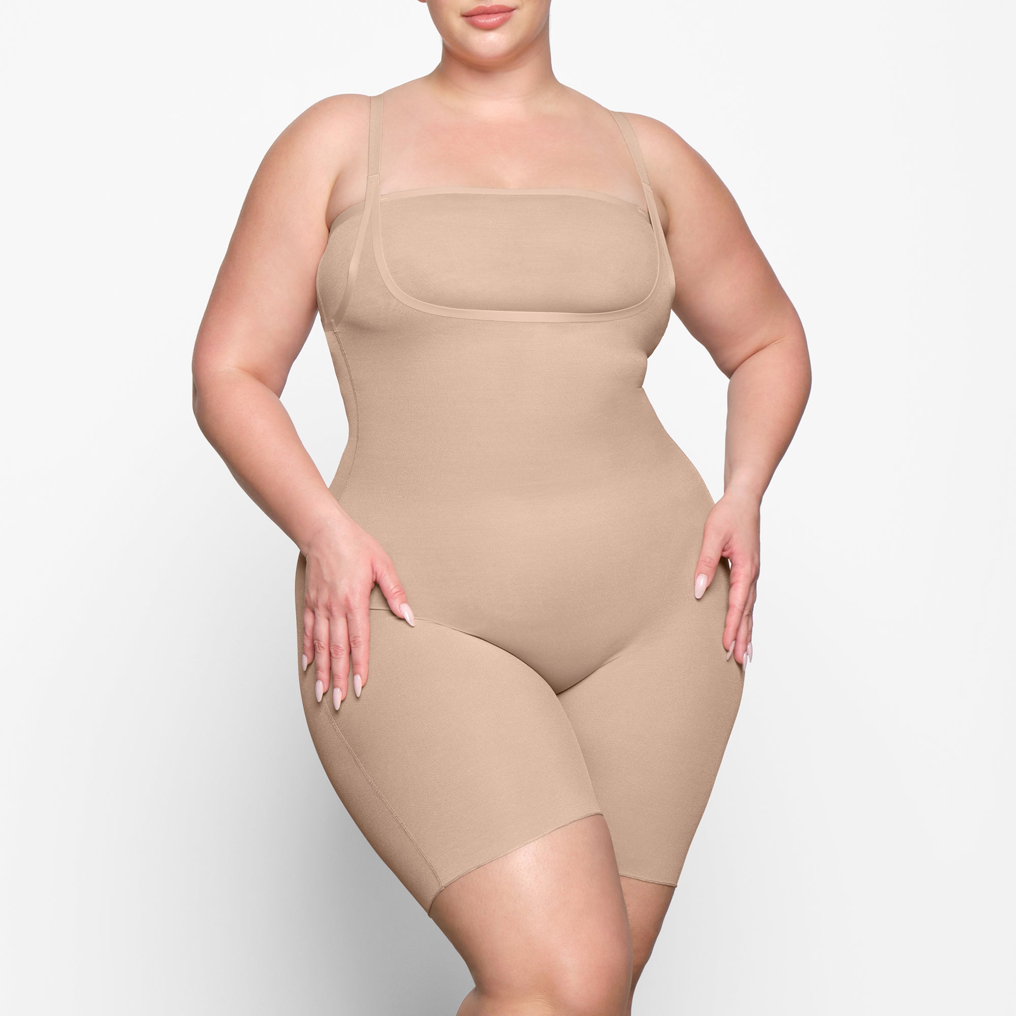 SKIMS on X: The Open Bust Bodysuit holds in your core, shapes and