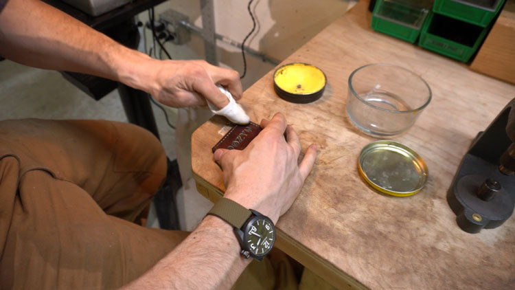 Putting saddle soap on custom leather patch.