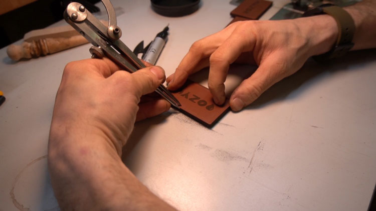 Marking leather patch to sew.