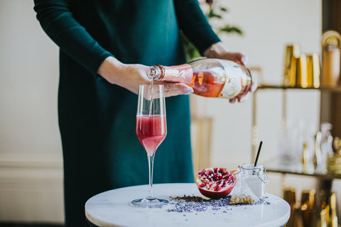 Pouring Chill Out cocktail with Wild Life Botanicals Blush non-alcoholic sparkling wine 