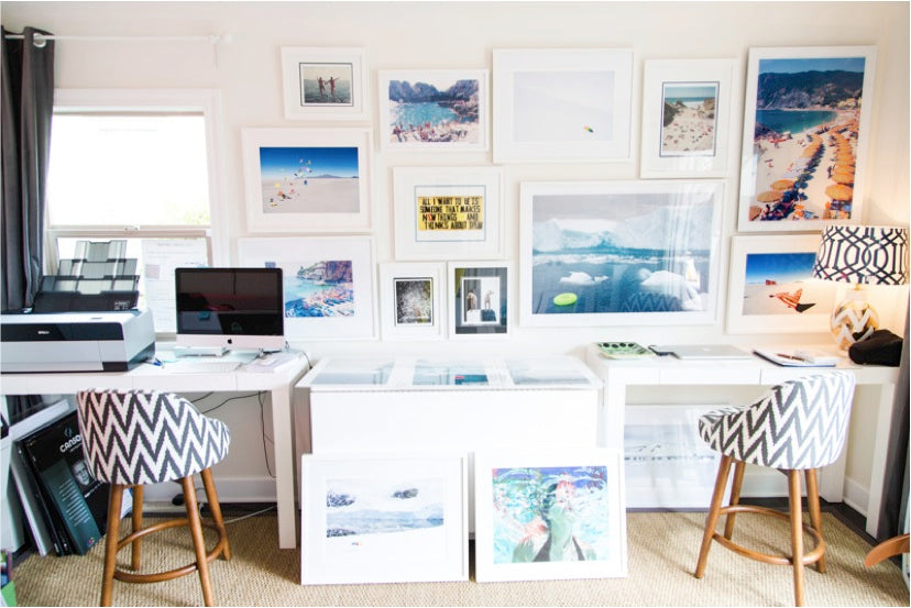 A gallery wall at the home of Gray Malin via Simply Framed