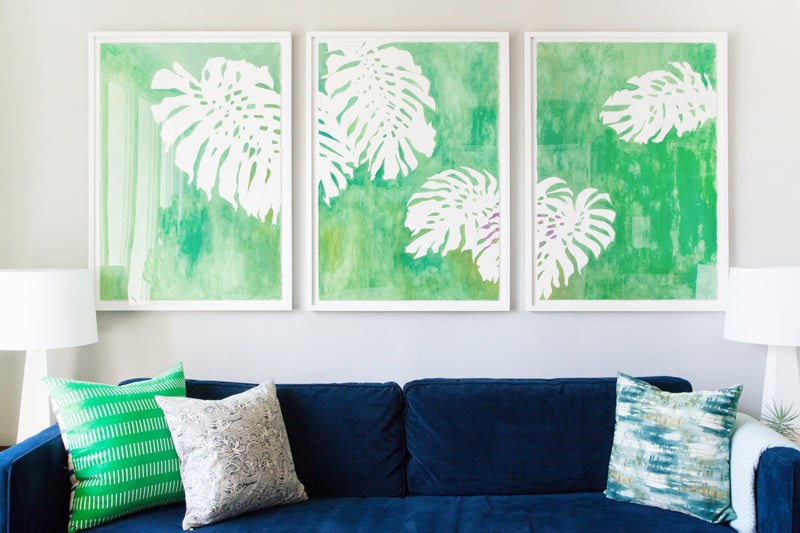 Orlando Soria's living room makeover featuring the work of Erika Gragg, framed by Simply Framed. Photos via Sean Gin