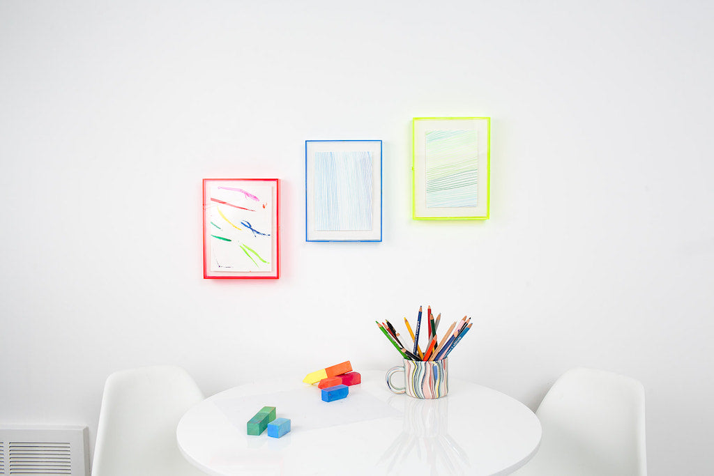 simply framed max plexibox in color neon gallery wall
