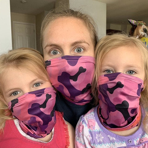 Mom and kids wearing pup scruffs as face masks
