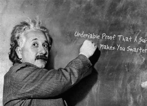 Albert Einstein writing Undeniable Proof That A Suit Makes You Smarter on a blackboard