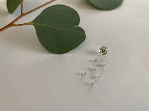 Loose diamonds in various shapes waiting to go into a custom engagement ring