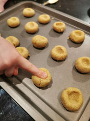 Image of making an indent in Christmas biscuit dough