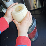 Child helping to blend smoothie