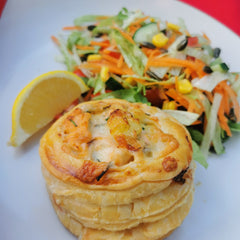 Individual Cheesy Salmon & Potato Pies, served with a lemon wedge and side salad