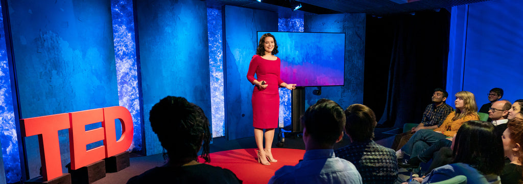Our CEO Jessica Ochoa Hendrix giving a talk on the TED stage