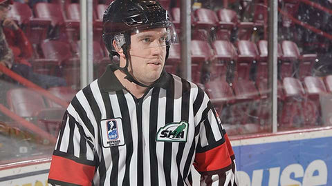 Referee Troy Murray skates up the ice at the World Under-17 Challenge