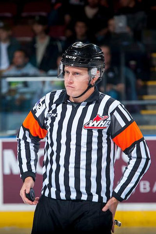 Referee Ward Pateman patrols the ice during a WHL game