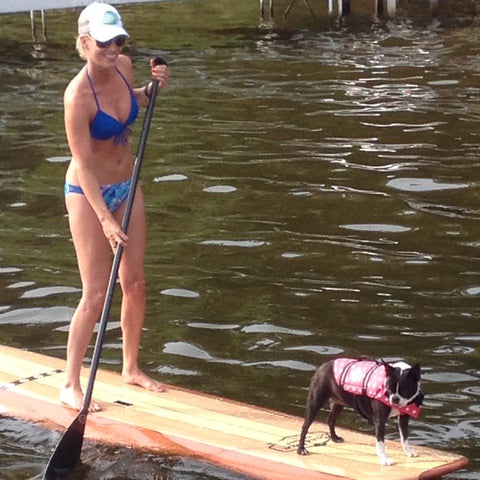 stand up paddleboarding with a dog