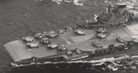 Avengers and Martlets in a variety of camouflage schemes, though all carrying the USN star, on the deck of 'USS ROBIN' (HMS VICTORIOUS). 