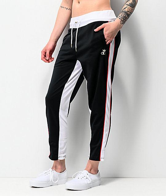 black track pants with red and white stripe
