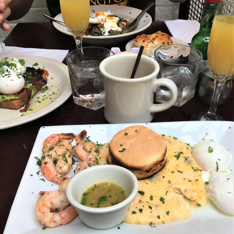 Shrimp and cheesy grits served with coffee and bottomless mimosas at Essex.