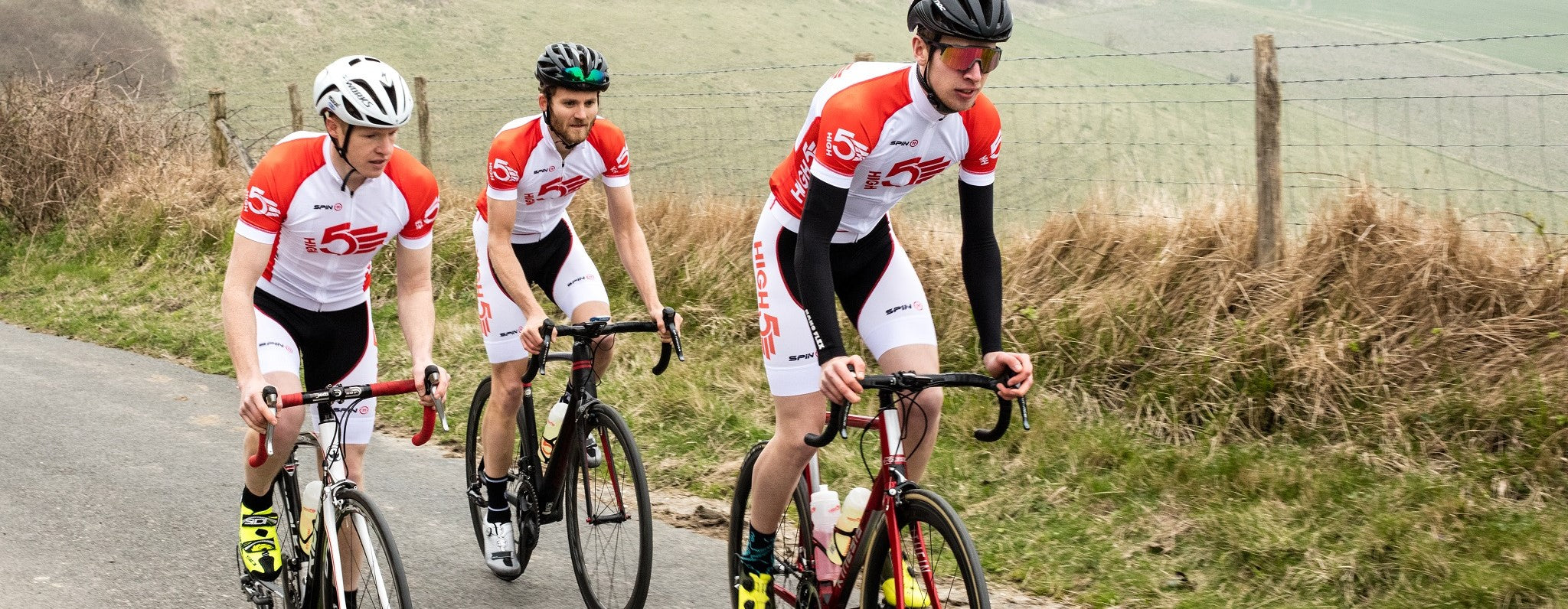 3 Cyclists in HIGH5 gear