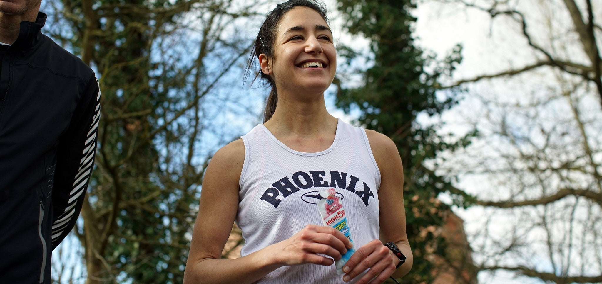 Woman taking HIGH5 Energy Gel Aqua