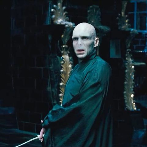 Voldemort from Harry Potter with white face black clothes 