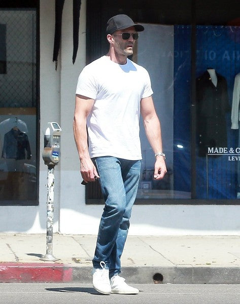 JASON STATHAM in white shirt, jeans, cap and sunglasses walking in the street