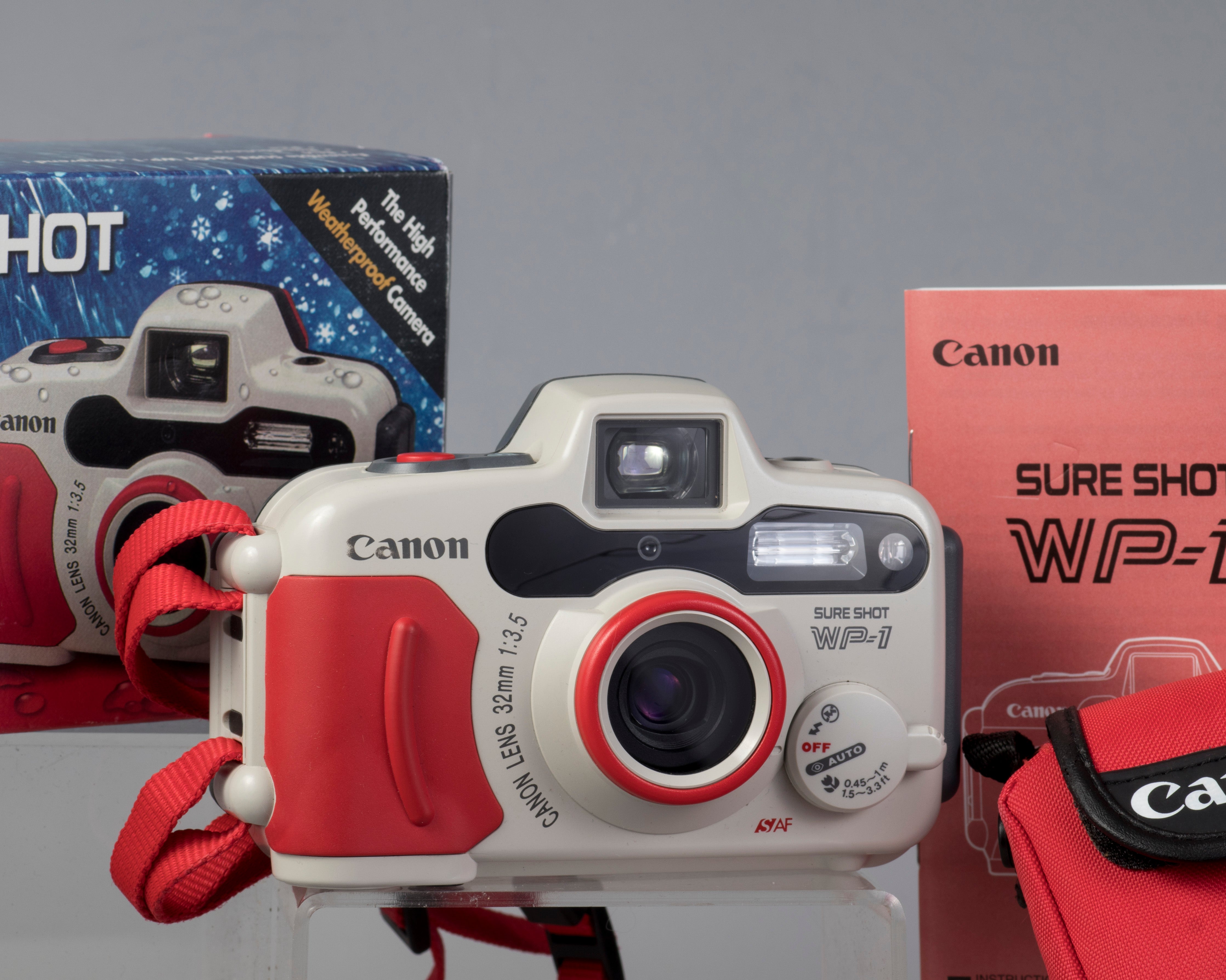 Canon Sure Shot WP-1 waterproof camera outfit w/original box, case, and  manual (serial 1116942)