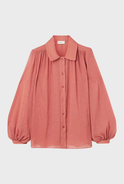Cut from airy chiffon in a billowy silhouette, this Gathered Shoulder Blouse is rendered in a beautiful redwood color inspired by the works of contemporary artist, Katharina Grosse. Style under a blazer to complete the look to wear while working from home.