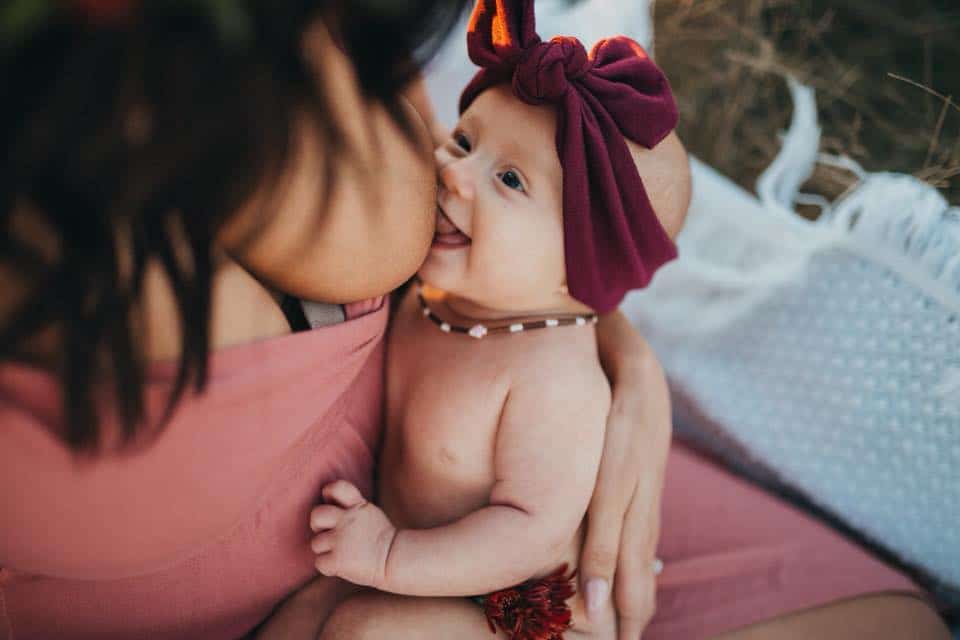 breastfeeding baby topknot vintage fashion style photoshoot prenatal baby newborn latching