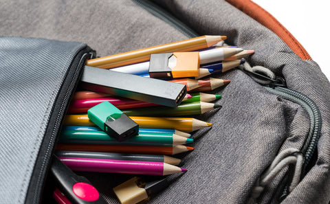 backpack with colored pencils and vapes 