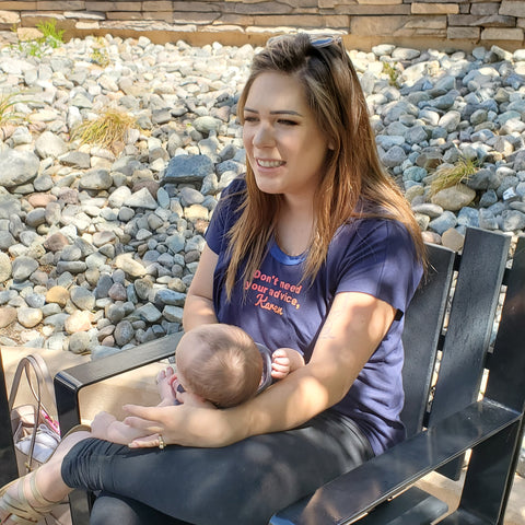 A seated white woman with a baby in her lap