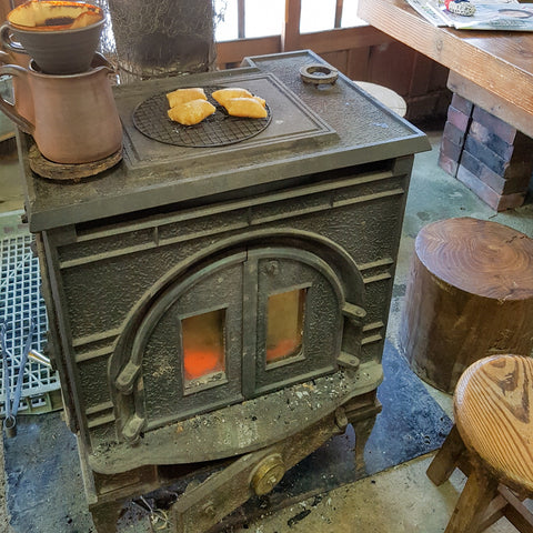Walnut mochi warming on a wood-fired stove