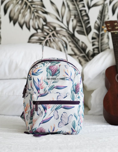 The cutest mini back pack for on the go eseentials with a gorgeous island dream print with tropical flowers and butterflies. Crimson tavernorlando 