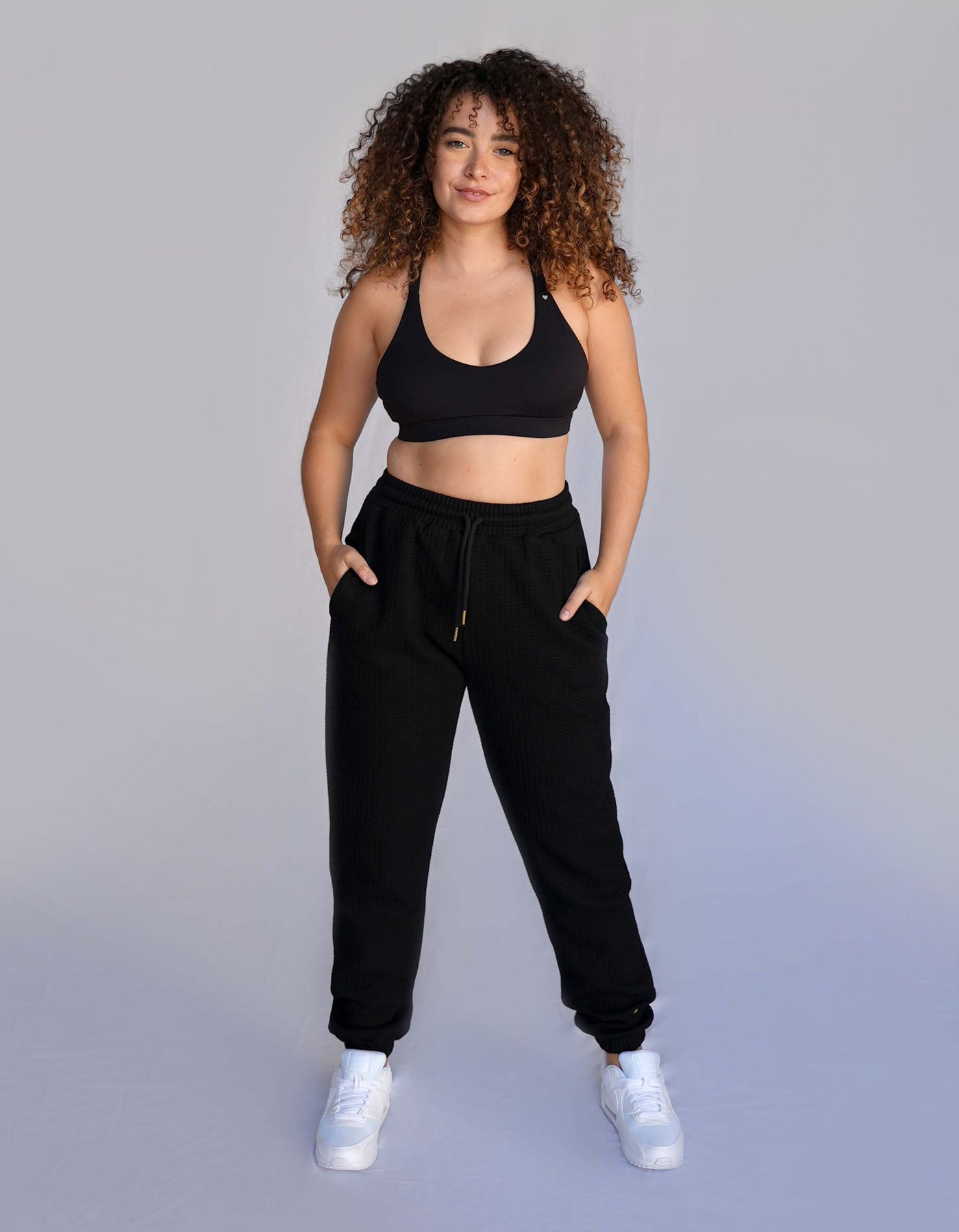 Crimson tavernorlando Phaedra Joggers in the color black. Waffle texture with pockets and drawstring to adjust the waistband.