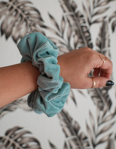 Velvet ribbed oversized scrunchie on a wrist to show the beautiful over sized look. perfect to wrap around hair twice