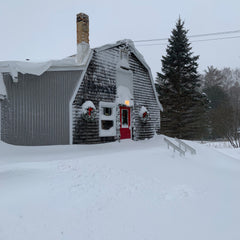 Ellison Bay Pottery barn covered with snow